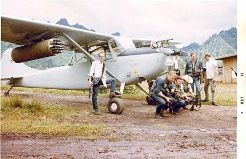Ravens operators in front of an O-1 Bird Dog used for FAC missions
